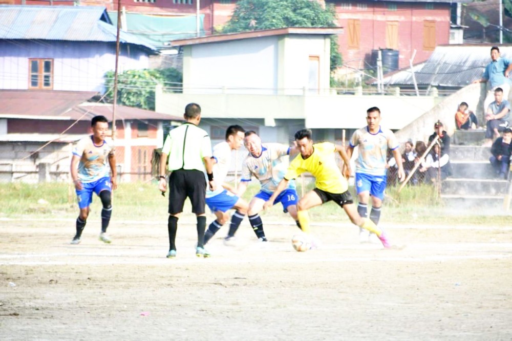 Players of Moanungsang Memorial Sporting Club (yellow jerseys) and DEF (brown and blue jerseys) in action on the third day of the ongoing MDFA Trophy 2024 at Imkongmeren Sports Complex on October 17.